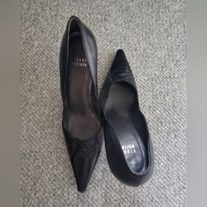 A pair of black Stuart Weitzman heels